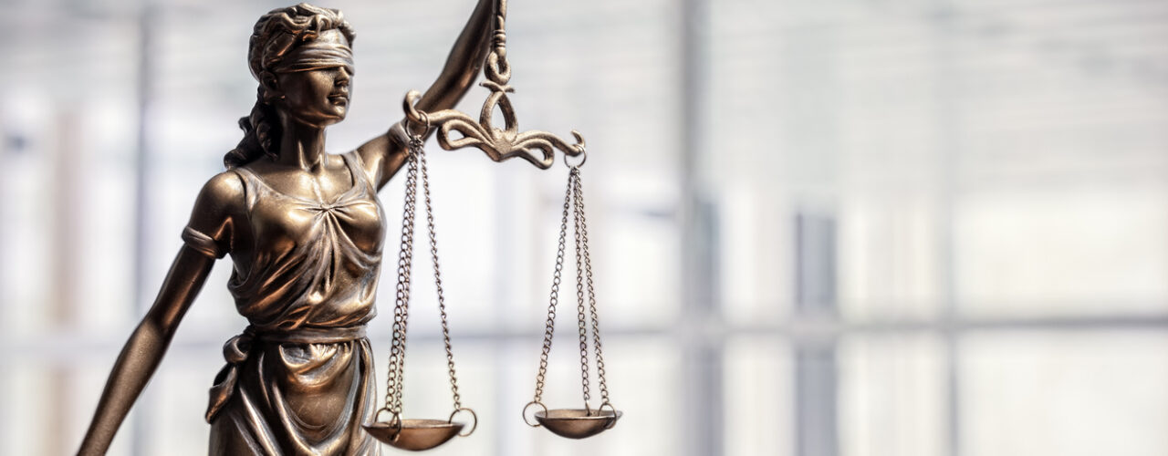 Legal and law concept statue of Lady Justice with scales of justice and office background