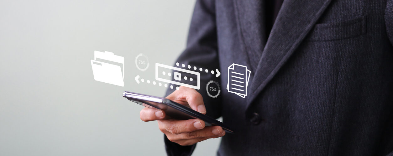 Businessman sending file transfer, backup, and download documents online by smartphone. Online documentation database and process automation Receive - send, and exchange on cloud computing.