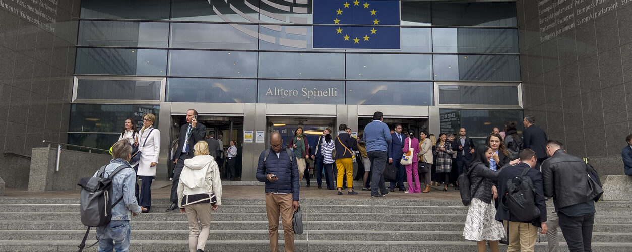 People walk outside of the European Parliament in Brussels, Belgium on September 20, 2023.
