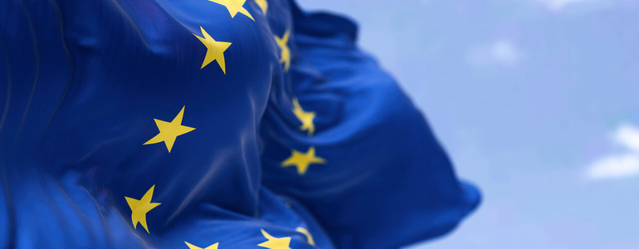 The flag of The European Union flapping in the wind. Economic and finance Community. Politics and Economy. Transnational political government