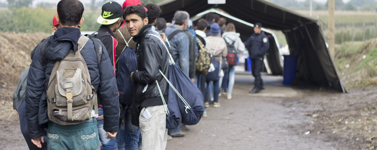 Sid, Serbia - October 17, 2015: Refugees waiting to cross the Serbo-Croatian border between the cities of Sid (Serbia) and Bapska (Croatia).