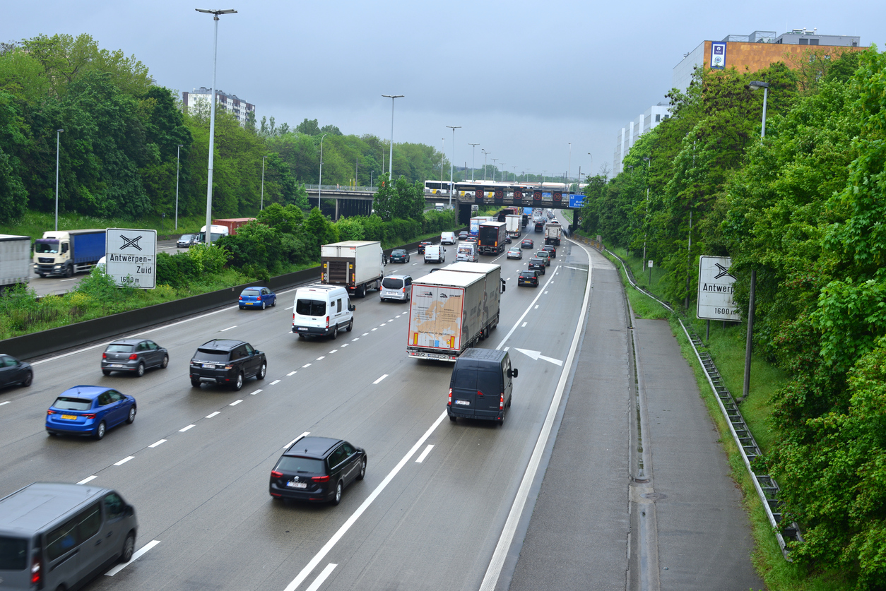 Berchem, province Antwerp, Belgium - May 12, 2023: multiple highway autostrade Ring 1 A1 commuters in their cars and truck drivers riding slowly in a traffic jam